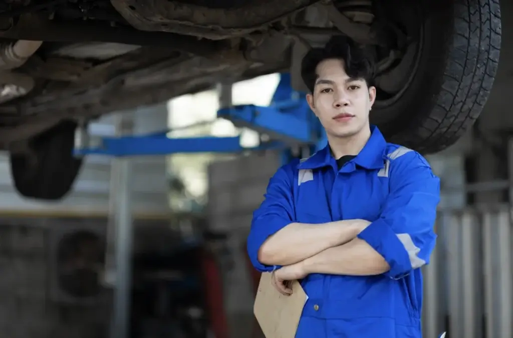 singapore car scrap yard parts, Male car mechanic standing